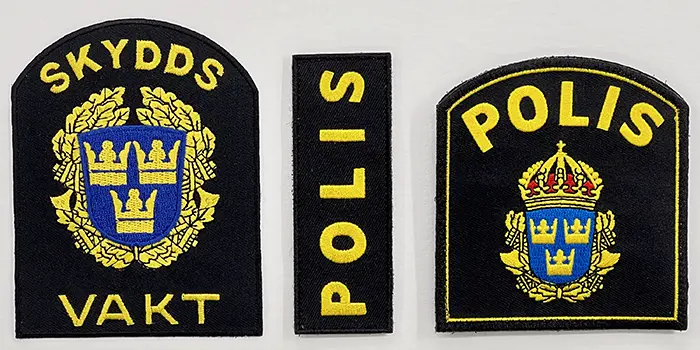 Uniformsmärken för polis och väktare.